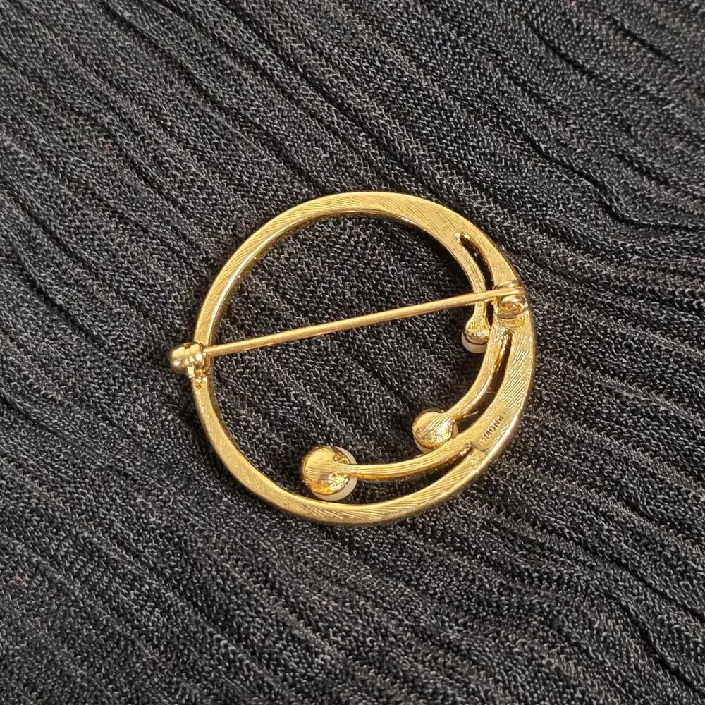 Vintage Monet Gold Tone Faux Pearl Circle Brooch Modernist Swirl Pin